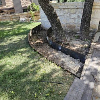 Sierra Scapes Landscaping - Corten steel flowerbed around 2 trees - Landscaping Near Me - Austin, Texas Sierra Scapes Landscaping - Corten steel flowerbed around 2 trees - Landscaping Near Me - Austin, Texas