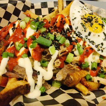Marination Ma Kai - Aloha fries! Fries topped with mayo, kimchi sauce, kalua pork, and egg - Korean Near Me - Seattle, Washington