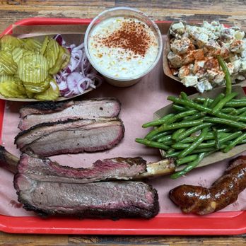 Terry Black's Barbecue - Cream corn, green beans, potato salad, 0.25 lb jalapeño sausage, beef rib, 0.5 lb brisket, onion & pickles - Barbeque Near Me - Dallas, Texas