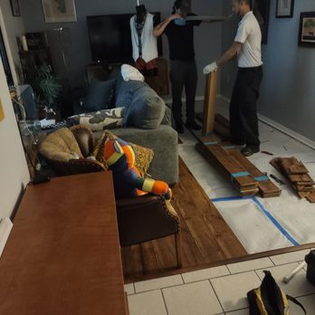 DriRite - Alex and Luis removing the damaged laminate. - Damage Restoration Near Me - Winter Garden, Florida