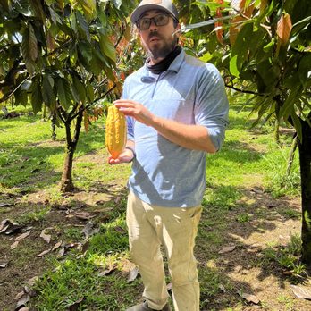 Lavaloha - Our guide showing us the most common cacao seed pod. - Chocolatiers & Shops Near Me - Hilo, Hawaii