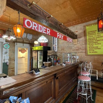 Happy Pizza - a counter and chairs in a restaurant - Pizza Near Me - Hackensack, Minnesota Happy Pizza - a counter and chairs in a restaurant - Pizza Near Me - Hackensack, Minnesota