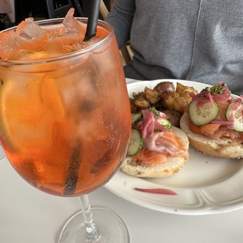Caroline's On Main - Aperol spritz and salmon bagel - Breakfast & Brunch Near Me - Flowery Branch, Georgia Caroline's On Main - Aperol spritz and salmon bagel - Breakfast & Brunch Near Me - Flowery Branch, Georgia