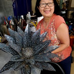 Gearhead Workshops - Tig artist with her beautiful work. Plasma cut and Tig.