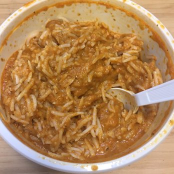 Crave India - a bowl of food with a spoon in it - Indian Near Me - Vancouver, British Columbia Crave India - a bowl of food with a spoon in it - Indian Near Me - Vancouver, British Columbia