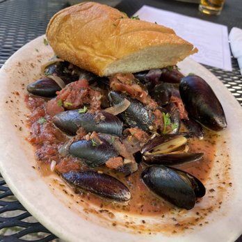 Europa Bar & Cafe - Fra Diavlo mussels with baguette - Modern European Near Me - Greensboro, North Carolina Europa Bar & Cafe - Fra Diavlo mussels with baguette - Modern European Near Me - Greensboro, North Carolina