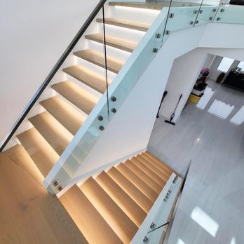 Rabbit Floors - a modern staircase with glass railings - Carpeting Near Me - Boca Raton, Florida