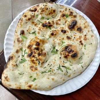 Rani's World Foods - a flat bread on a paper plate - International Grocery Near Me - Houston, Texas Rani's World Foods - a flat bread on a paper plate - International Grocery Near Me - Houston, Texas