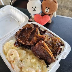 Trydis - Triple Threat plate: kalbi, Lilikoi smoked meat, and creamy garlic shrimp ...comes with rice and pasta salad