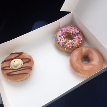 Krispy Kreme - Glazed donut, strawberry frosted with sprinkles, and a cookie dough donut - Donuts Near Me - Raleigh, North Carolina