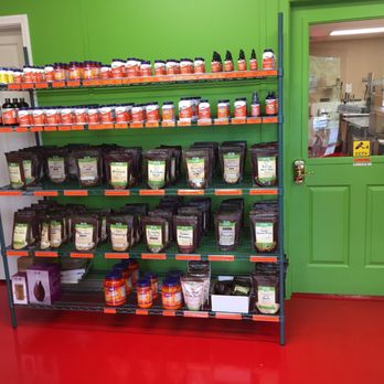 Quench Juice - a shelf of juices and condiments - Fruits & Veggies Near Me - Jackson, Tennessee