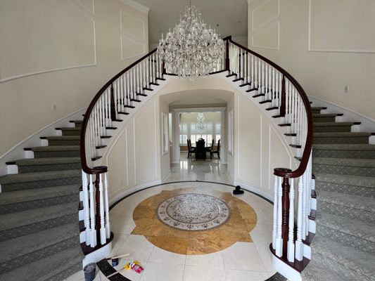 Stair and railing refinish - We refinished/converted a large stairway and railing set, changing them from golden maple to dark cherry and white. After sanding and cleaning, we applied dark stain to railings and landings then finished with several three coats of commercial cabinet finish. After the stained portion was finished we meticulously taped off the stained portion and finished the spindles and kick boards with two coats of commercial grade cabinet primer and 3 coats of finish with hardener for extra chemical resistance. Stair and railing refinish - We refinished/converted a large stairway and railing set, changing them from golden maple to dark cherry and white. After sanding and cleaning, we applied dark stain to railings and landings then finished with several three coats of commercial cabinet finish. After the stained portion was finished we meticulously taped off the stained portion and finished the spindles and kick boards with two coats of commercial grade cabinet primer and 3 coats of finish with hardener for extra chemical resistance.