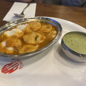 Mavalli Tiffin Rooms - Button idly in rasam - Indian Near Me - Bellevue, Washington Mavalli Tiffin Rooms - Button idly in rasam - Indian Near Me - Bellevue, Washington