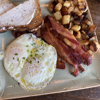 First Watch - Traditional breakfast-two eggs, over easy, perfectly cooked bacon, homemade toast and potatoes. Yum! - Breakfast & Brunch Near Me - Joplin, Missouri