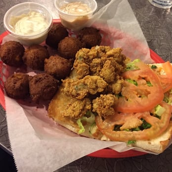 Soul Fish Cafe - Oyster po'boy with hushpuppies. - Southern Near Me - Memphis, Tennessee Soul Fish Cafe - Oyster po'boy with hushpuppies. - Southern Near Me - Memphis, Tennessee