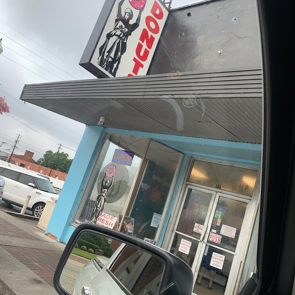 a view of the outside of a donut shop