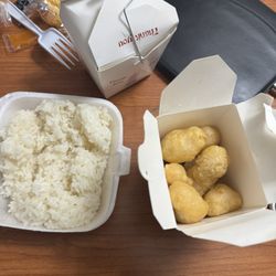 China Garden II - Mini box of chicken and, a small container of white rice to share. This is apparently $28 worth of food. What a joke.