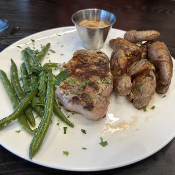 Sierra Grill - Pork chop with green beans and house apple sauce - Steakhouses Near Me - Lenexa, Kansas Sierra Grill - Pork chop with green beans and house apple sauce - Steakhouses Near Me - Lenexa, Kansas