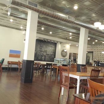 Vibe Coffee - a woman sitting at a table in a cafe - Coffee & Tea Near Me - Hodgenville, Kentucky Vibe Coffee - a woman sitting at a table in a cafe - Coffee & Tea Near Me - Hodgenville, Kentucky