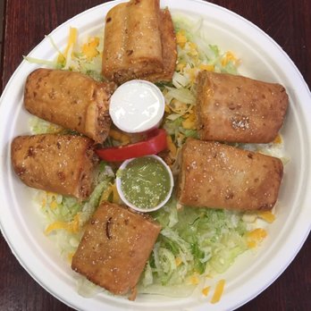 Tin-Tan Tacos - a plate of food with sauce - Mexican Near Me - Pullman, Washington Tin-Tan Tacos - a plate of food with sauce - Mexican Near Me - Pullman, Washington