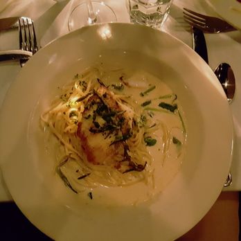 Cafe Tiramisu - Sea bass over linguini with creamy sauce and spinach. - Italian Near Me - Raleigh, North Carolina