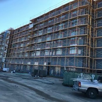 KM Lath & Plaster  - a building under construction - Stucco Services Near Me