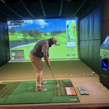 Loft & Lies - a man playing golf in a simulator - Golf Near Me - McMinnville, Oregon Loft & Lies - a man playing golf in a simulator - Golf Near Me - McMinnville, Oregon