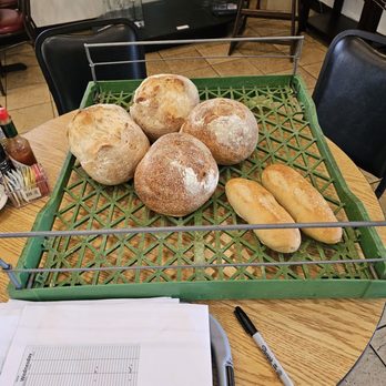 Our Daily Bread Bakery & Bistro - Some of the fresh bread as they are wrapped and place on the bread shelves. - French Near Me - Vinton, Virginia Our Daily Bread Bakery & Bistro - Some of the fresh bread as they are wrapped and place on the bread shelves. - French Near Me - Vinton, Virginia
