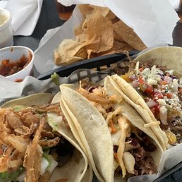 From left: black bean taco, brisket, and pork & peach.