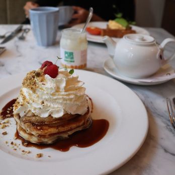 Jansz - Buttermilk pancakes with banana compote and candied walnut - Modern European Near Me - Amsterdam, New Hampshire Jansz - Buttermilk pancakes with banana compote and candied walnut - Modern European Near Me - Amsterdam, New Hampshire