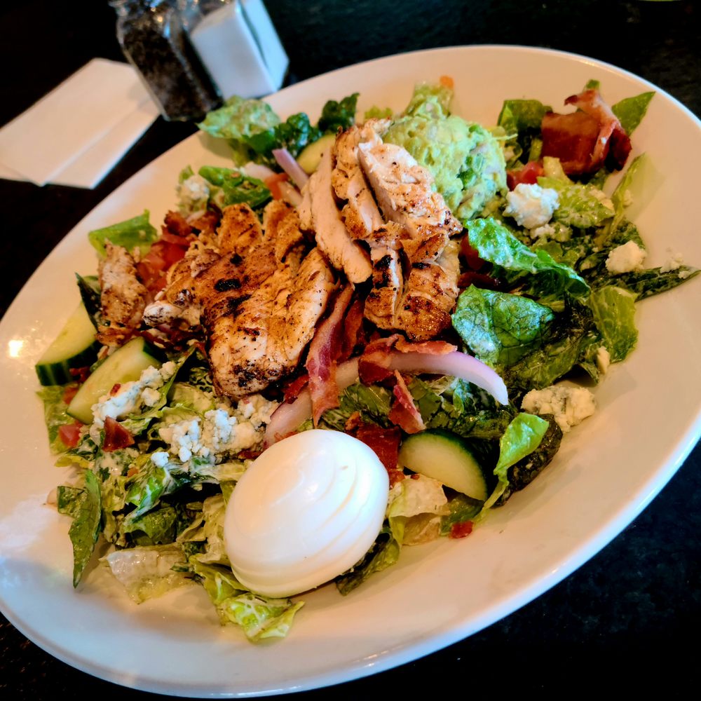 BRU Burger Bar - Buttermilk Cobb Salad: Romaine, Bacon, Tomato, Guacamole, Red Onion, Boiled Egg, Gorgonzola, Cucumber; added chicken, held the croutons. - Burgers Near Me - Noblesville, Indiana BRU Burger Bar - Buttermilk Cobb Salad: Romaine, Bacon, Tomato, Guacamole, Red Onion, Boiled Egg, Gorgonzola, Cucumber; added chicken, held the croutons. - Burgers Near Me - Noblesville, Indiana