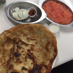 Mehlawa fresh from the frying pan served with boiled egg, puréed tomato, harif and tahini. Mehlawa fresh from the frying pan served with boiled egg, puréed tomato, harif and tahini.