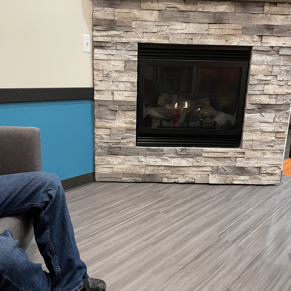 Biggby Coffee - Relaxing fireplace for 2 in front, ask at the order window if it needs to be turned on. - Coffee & Tea Near Me - White Lake, Michigan