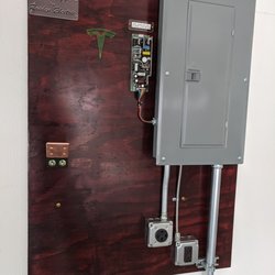Raiden Electric - 100 amp sub-panel in an attached garage for charging two Teslas at a time.  NO ONE has better looking charger installs than Raiden Electric.