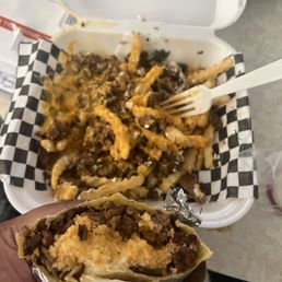 Dry super burrito and steak cheese fries. Dry super burrito and steak cheese fries.