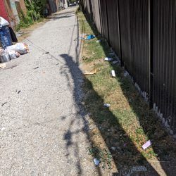 Vapor Bar & Smokeshop - Wizard's Vape Shop illegally dumping litter behind their store and ruining the community they operate in