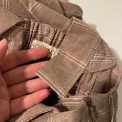 Two Tiny Tailors - Where the buttons used to be and where they cut and re-attached the straps.