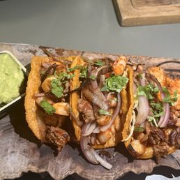 Mar y Tierra tacos (ribeye and shrimp). You get three small-to-medium tacos on corn tortillas. They were really good Mar y Tierra tacos (ribeye and shrimp). You get three small-to-medium tacos on corn tortillas. They were really good