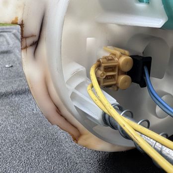 Hugh White Chevrolet - Bottom view of damaged area where a piece of the plastic is missing. - Car Dealers Near Me - Lancaster, Ohio