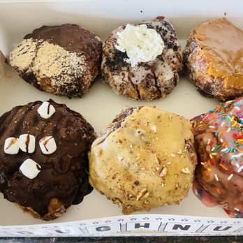 Parlor Doughnuts - From top left clockwise: Churro, Cookies N' Cream, Bourbon Caramel, strawberry frosted, Maple Pecan, and Campfire - Donuts Near Me - Phoenix, Arizona
