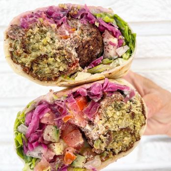 Layla's Falafel - a hand holding a sandwich - Falafel Near Me - Westport, Connecticut