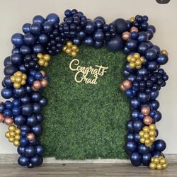 M Space - Grass wall with ballon decor on stage used for photos by PrettyNPlanned LLC
