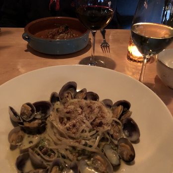 Feast - Clam Linguini with Cedergreen Chenin Blanc; In the background: Duck Cassoulet and Meyney Bordeaux - French Near Me - Kirkland, Washington