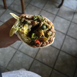 Chronic Tacos - Ordered breakfast burrito and got a fat burrito of refried beans instead and little of everything else. No salsa. Not worth the $.