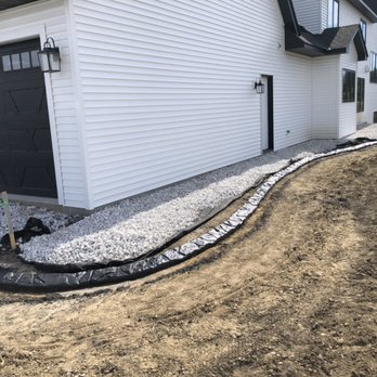 Curb-It Design - Triple gray Natural Stone Curbing on New Contstruction - Landscaping Near Me - Shakopee, Minnesota Curb-It Design - Triple gray Natural Stone Curbing on New Contstruction - Landscaping Near Me - Shakopee, Minnesota