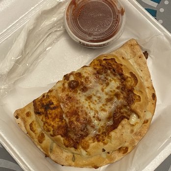 Pizza Leon - Custom Calzone - extra mozz, garlic, and chicken - Pizza Near Me - Austin, Texas Pizza Leon - Custom Calzone - extra mozz, garlic, and chicken - Pizza Near Me - Austin, Texas