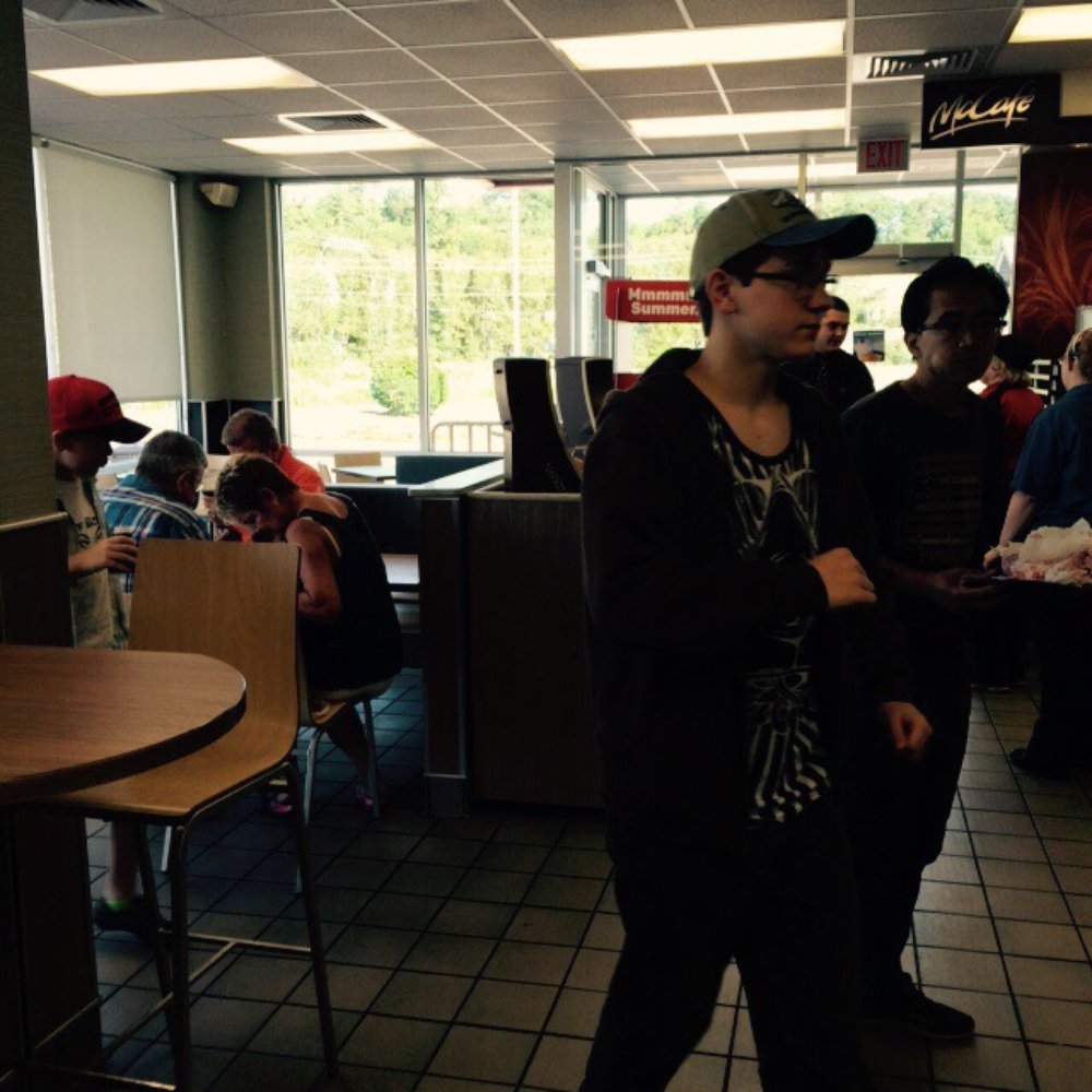 McDonald's - a man standing in a restaurant - Burgers Near Me - Gladstone, Michigan McDonald's - a man standing in a restaurant - Burgers Near Me - Gladstone, Michigan
