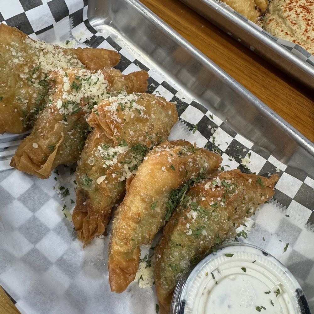 Simply Greek - Spanakopita (5) appetizer with a side of their delicious tzatziki. - Greek Near Me - Cypress, Texas Simply Greek - Spanakopita (5) appetizer with a side of their delicious tzatziki. - Greek Near Me - Cypress, Texas