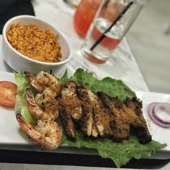 Aria Suya Kitchen - The sampler (comes with a side of jollof rice) - African Near Me - Houston, Texas