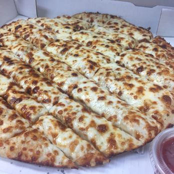 Korner Slice - Cheesy breadsticks with marinara dipping sauce. - Pizza Near Me - Humble, Texas Korner Slice - Cheesy breadsticks with marinara dipping sauce. - Pizza Near Me - Humble, Texas